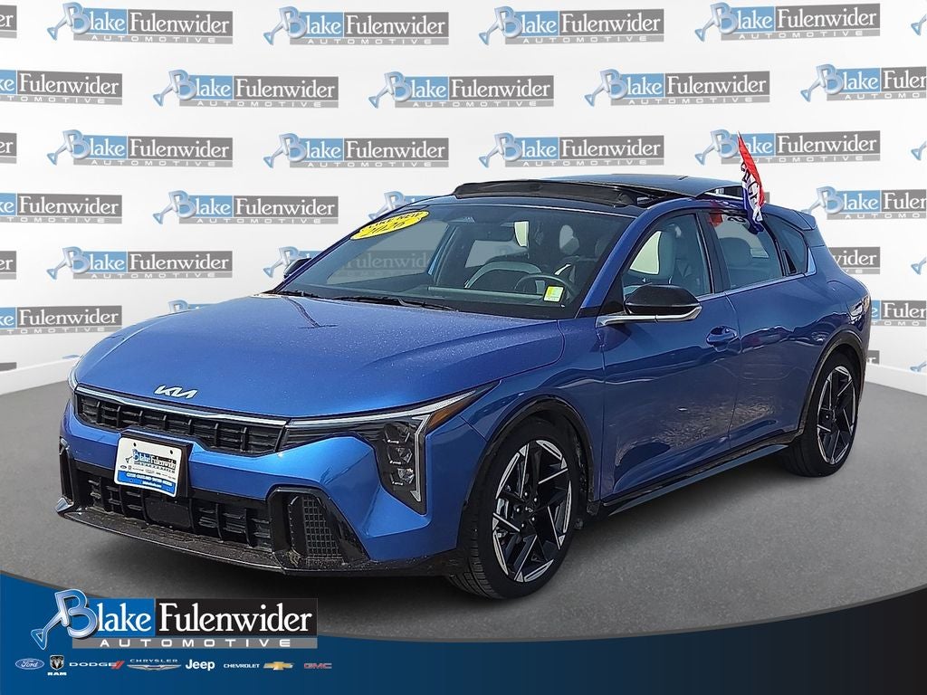 2026 Kia K4 GT-Line in Wave Blue — front three-quarter view
