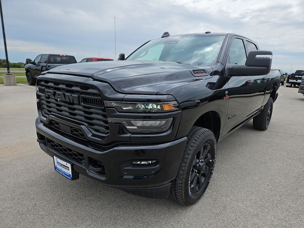 2026 RAM 2500 Big Horn in Diamond Black Crystal Pearlcoat — front three-quarter view