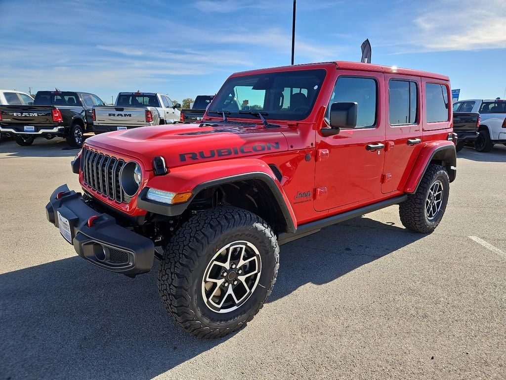 2026 Jeep Wrangler WRANGLER 4-DOOR RUBICON in Firecracker Red Clear-Coat Exterior Paint — front three-quarter view
