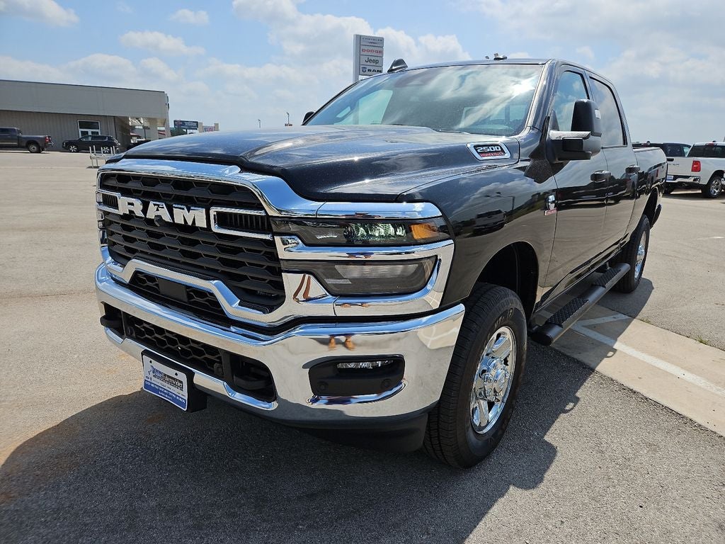 2026 RAM 2500 RAM 2500 TRADESMAN CREW CAB 4X4 6'4' BOX in Diamond Black Crystal Pearl-Coat Exterior Paint — front three-quarter view