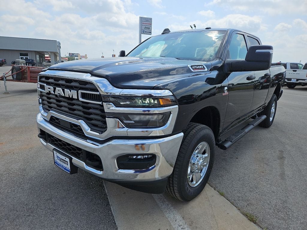 2026 RAM 2500 RAM 2500 TRADESMAN CREW CAB 4X4 6'4' BOX in Diamond Black Crystal Pearl-Coat Exterior Paint — front three-quarter view