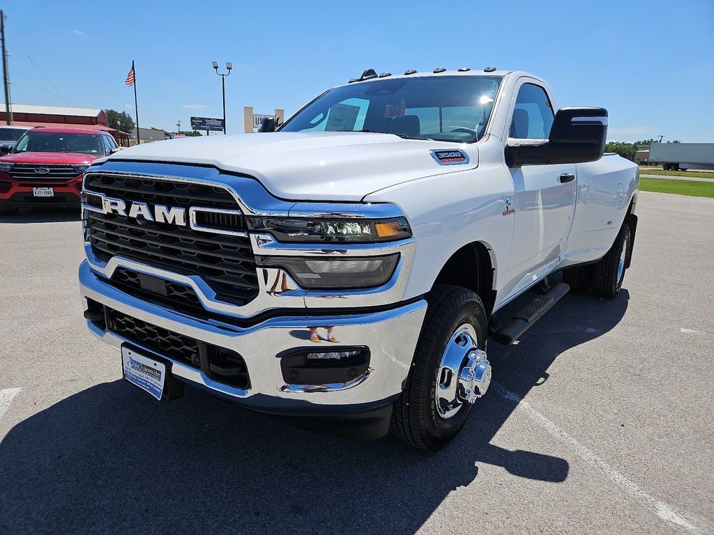 2026 RAM 3500 RAM 3500 TRADESMAN REGULAR CAB 4X4 8' BOX in Bright White Clear-Coat Exterior Paint — front three-quarter view