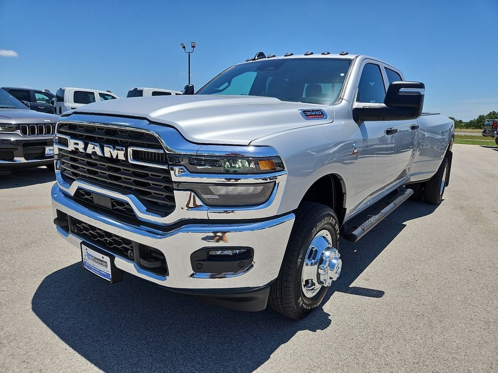 2026 RAM 3500 RAM 3500 TRADESMAN CREW CAB 4X4 8' BOX in Silver-Zynith Exterior Paint — front three-quarter view