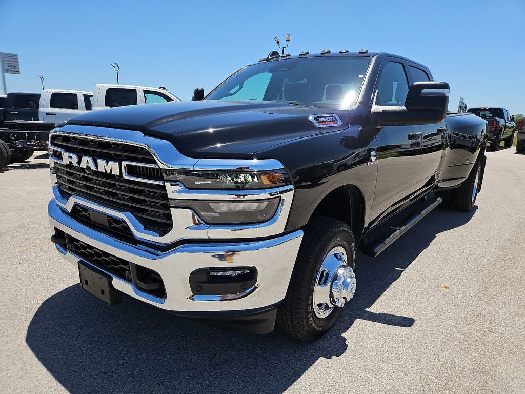 2026 RAM 3500 RAM 3500 TRADESMAN CREW CAB 4X4 8' BOX in Diamond Black Crystal Pearl-Coat Exterior Paint — front three-quarter view