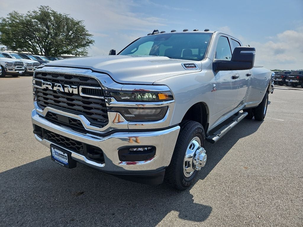 2026 RAM 3500 RAM 3500 TRADESMAN CREW CAB 4X4 8' BOX in Silver-Zynith Exterior Paint — front three-quarter view