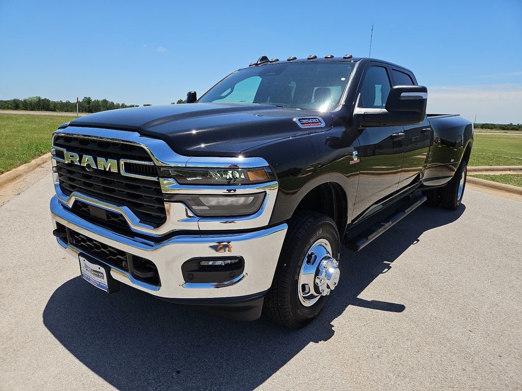 2026 RAM 3500 RAM 3500 TRADESMAN CREW CAB 4X4 8' BOX in Diamond Black Crystal Pearl-Coat Exterior Paint — front three-quarter view