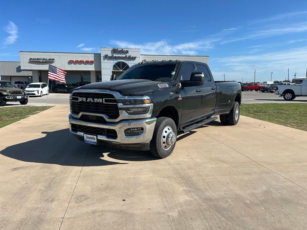 2025 RAM 3500 Tradesman Crew Cab 4x4 8' Box in Diamond Black Crystal Pearlcoat — front three-quarter view