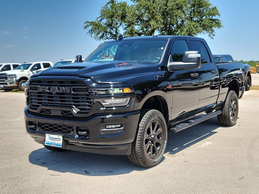 2026 RAM 2500 RAM 2500 BLACK EXPRESS CREW CAB 4X4 6'4' BOX in Diamond Black Crystal Pearl-Coat Exterior Paint — front three-quarter view