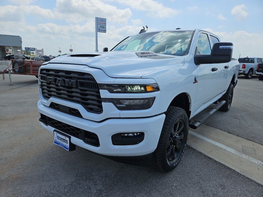 2026 RAM 2500 RAM 2500 BLACK EXPRESS CREW CAB 4X4 6'4' BOX in Bright White Clear-Coat Exterior Paint — front three-quarter view