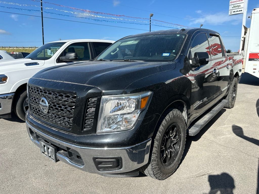 2019 Nissan Titan SV in Magnetic Black Metallic — front three-quarter view